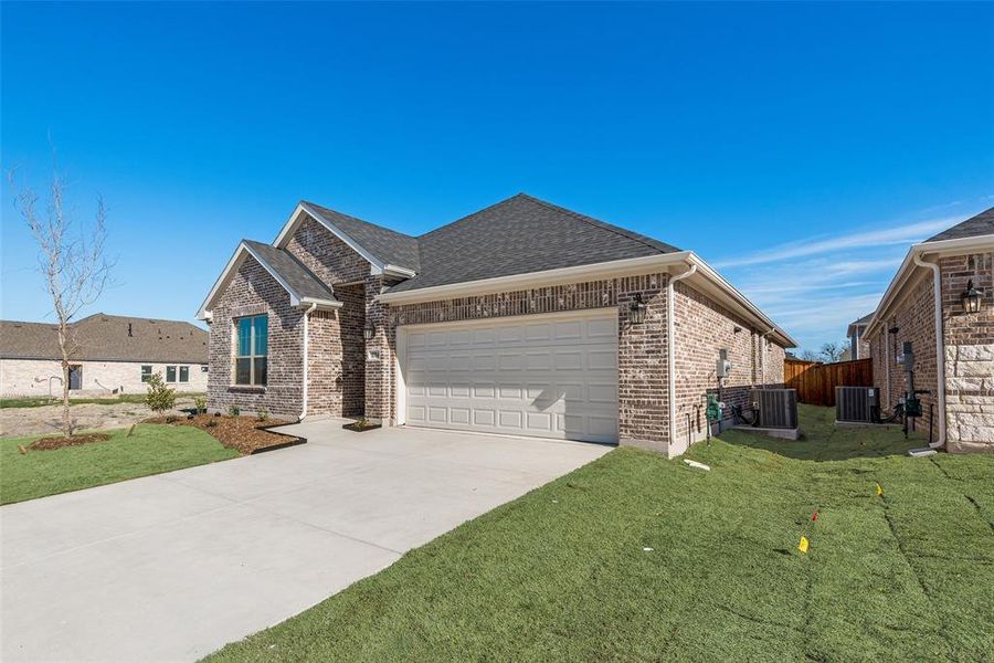 Front exterior of a new home in Walden Pond, Forney, TX, highlighting curb appeal (Image 2).