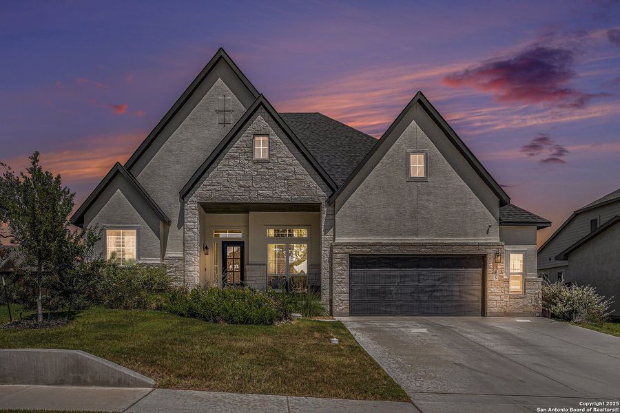 Front exterior of a new home in Mesa Western, Cibolo, TX, highlighting curb appeal (Image 1).