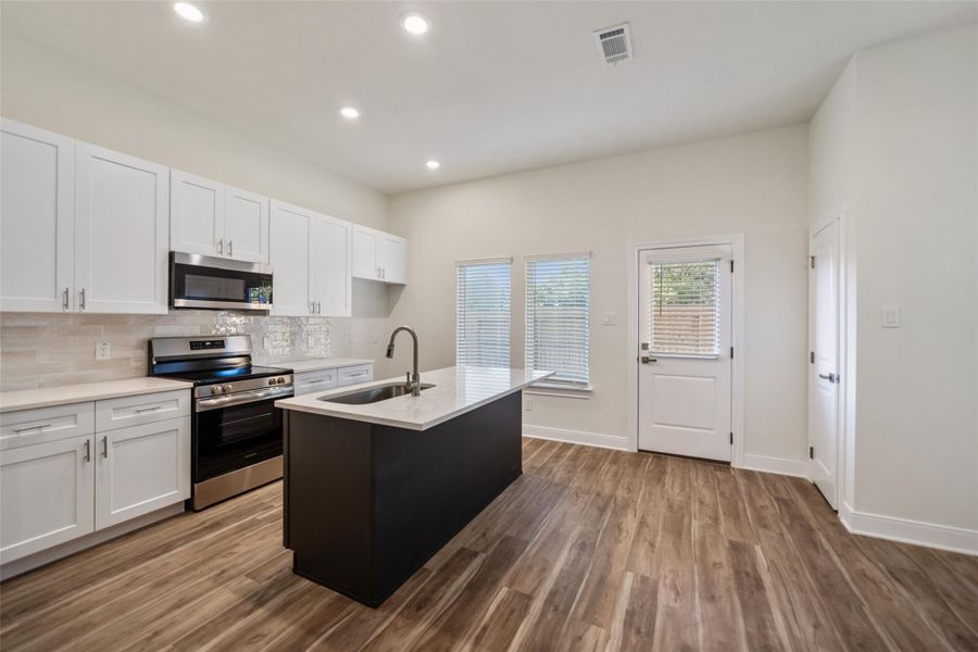 Granite counters and neutral backsplash. Granite counters and neutral backsplash.
