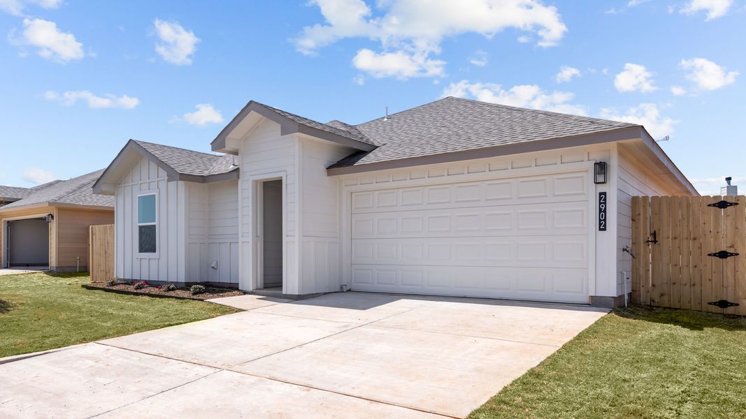 Representative exterior photo of a completed home built from the ASHBURN by D.R. Horton in Hampton Hills, Abilene, TX (Image 15).