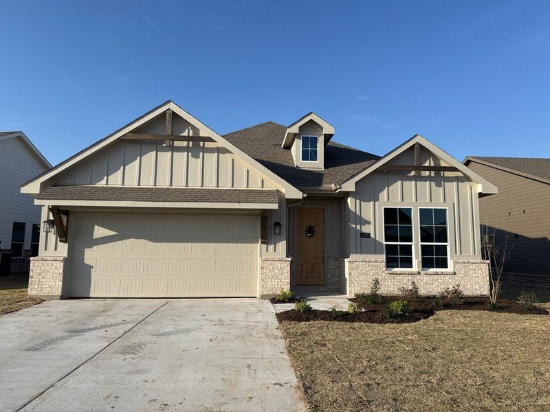 Front exterior of a new home in Covenant Park, Springtown, TX, highlighting curb appeal (Image 1). Front exterior of a new home in Covenant Park, Springtown, TX, highlighting curb appeal (Image 1).