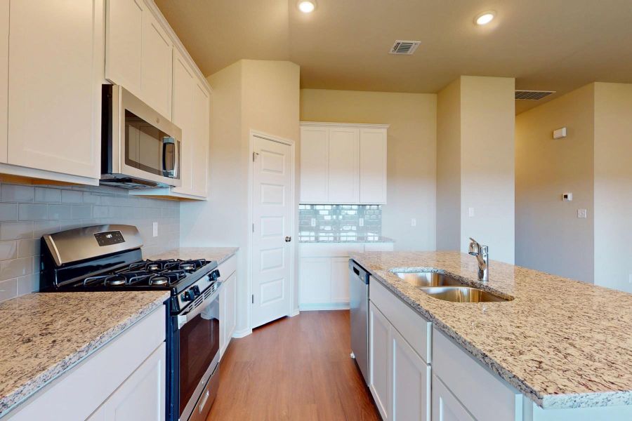 Furnished interior view inside a new home in Carillon, Manor (Image 7).