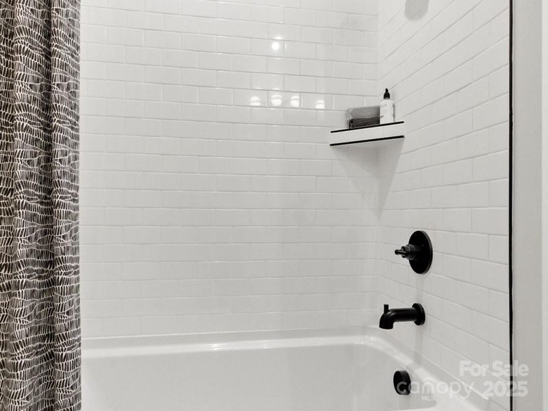 Upgraded Secondary Bathroom Tile Surround Shower. *Model Photos | Actual Finishes, Structural Selections, and Orientation May Vary.