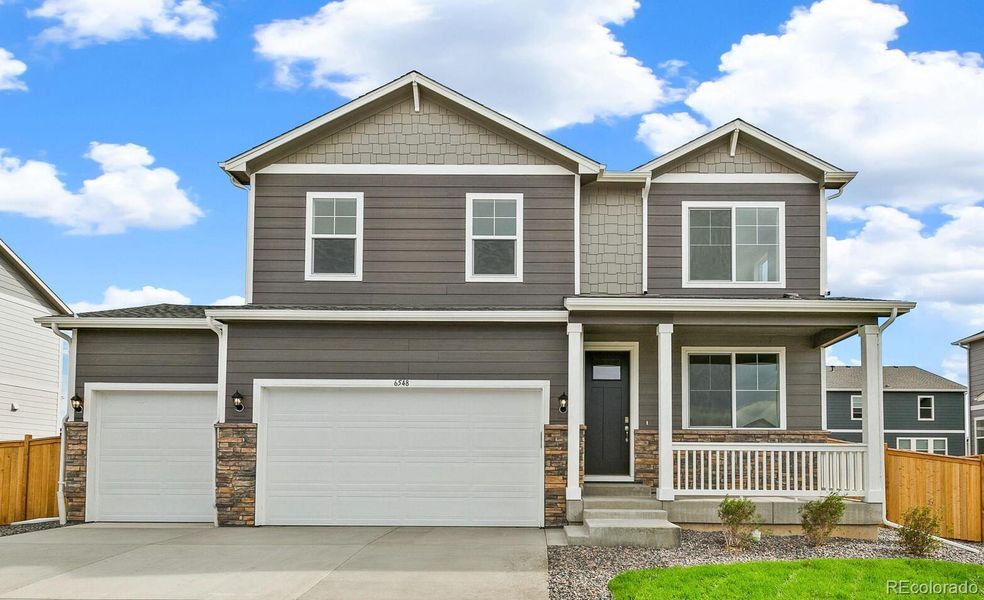 Front exterior of a new home in Lakeside Canyon, Mead, CO, highlighting curb appeal (Image 1).