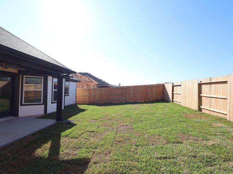 Exterior details and patio area of a home in Magnolia Ridge, Magnolia (Image 20).