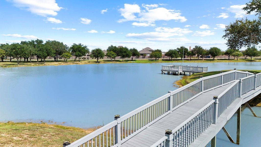 Scenic community lake with pedestrian bridge, providing tranquil water views and a peaceful place to stroll and enjoy the outdoors. The time will always read “play o’clock” at The Island Amenity Village, which is an oasis of fun for Marvida residents right in the community. Worries will slip away as you float along the lazy river and there will be hours of fun at the splashpad. Can’t decide between tennis and sand volleyball? Luckily, you can do it all! The amenity complex even gives four-legged family mem Scenic community lake with pedestrian bridge, providing tranquil water views and a peaceful place to stroll and enjoy the outdoors. The time will always read “play o’clock” at The Island Amenity Village, which is an oasis of fun for Marvida residents right in the community. Worries will slip away as you float along the lazy river and there will be hours of fun at the splashpad. Can’t decide between tennis and sand volleyball? Luckily, you can do it all! The amenity complex even gives four-legged family mem
