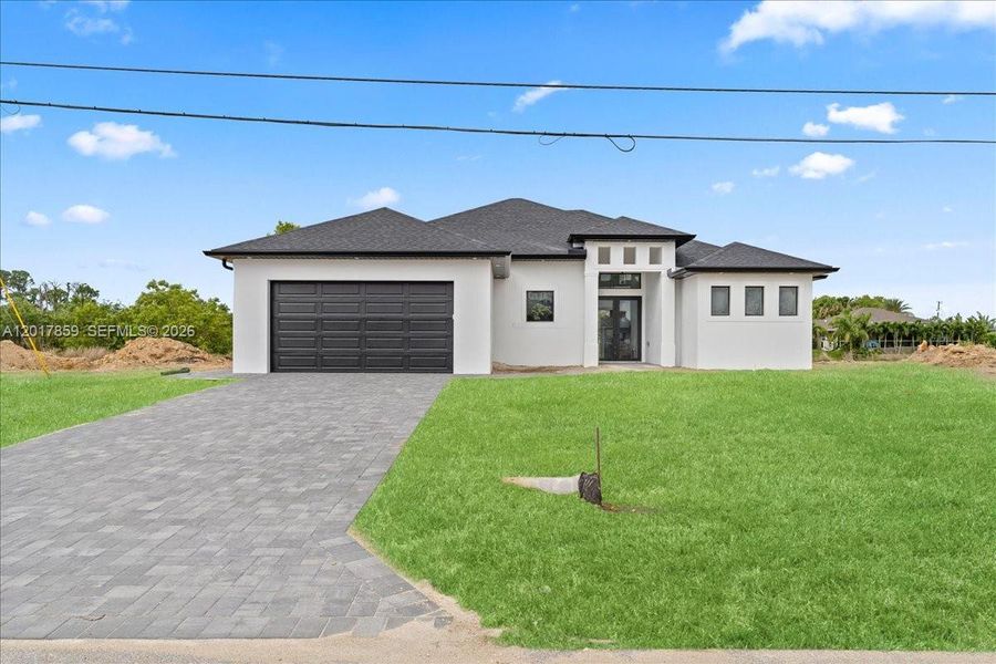 Front exterior of a new home in , Cape Coral, FL, highlighting curb appeal (Image 7).