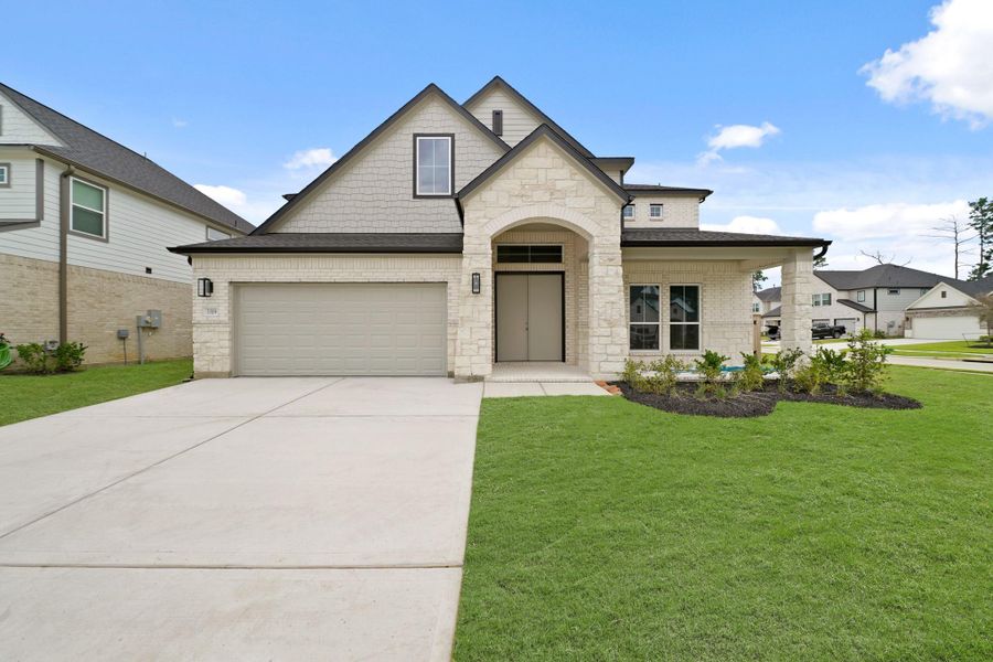 Front exterior of a new home in Barton Creek Ranch, Conroe, TX, highlighting curb appeal (Image 2). Front exterior of a new home in Barton Creek Ranch, Conroe, TX, highlighting curb appeal (Image 2).