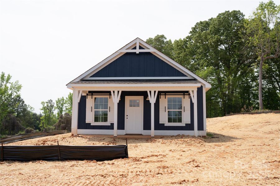 Front exterior of a new home in , Clover, SC, highlighting curb appeal (Image 18).