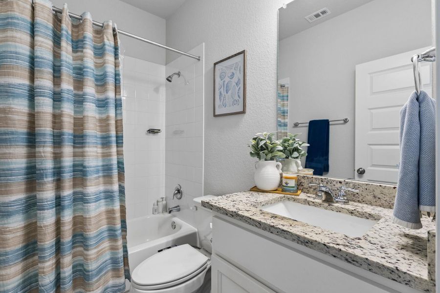 Furnished interior view inside a new home in Stallion Run, Buda (Image 15).