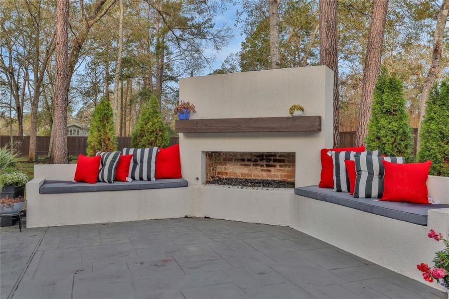 Cozy up to this outdoor fireplace with built in seating! Enjoy this outdoor area year round!