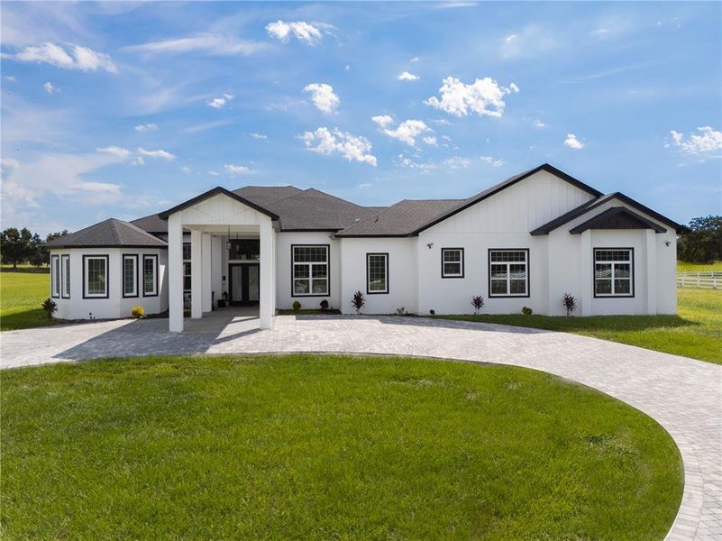 Front exterior of a new home in , Groveland, FL, highlighting curb appeal (Image 23).
