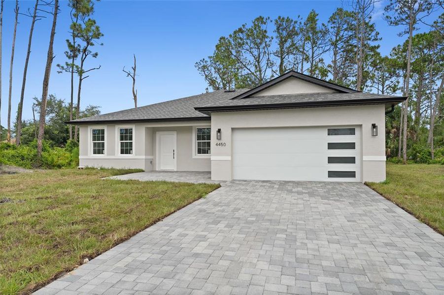 Front exterior of a new home in , North Port, FL, highlighting curb appeal (Image 2).