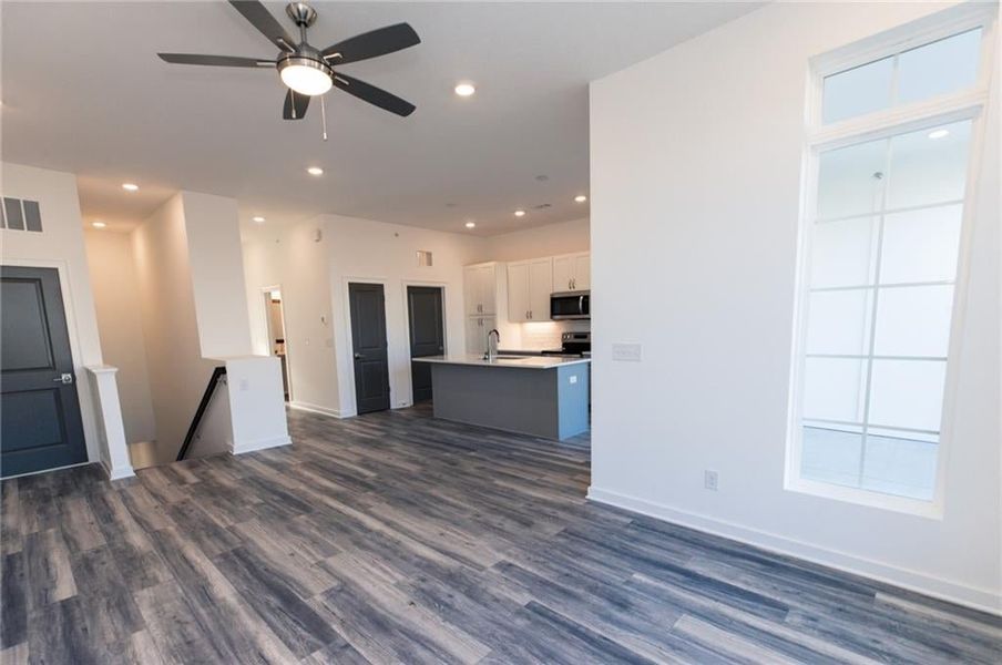 Open concept main level living featurse 9 ft ceilings making this a bright entertainment space! *Home is Under Construction. Photos shown are from other TPG Communities to display how the home will live*