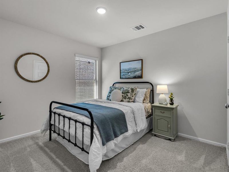 Back secondary bedroom offers plenty of space for kids or guests.