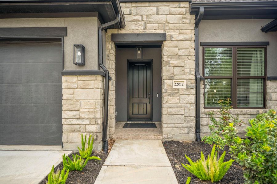 Exterior details and patio area of a home in The Highlands - 65', Porter (Image 4).