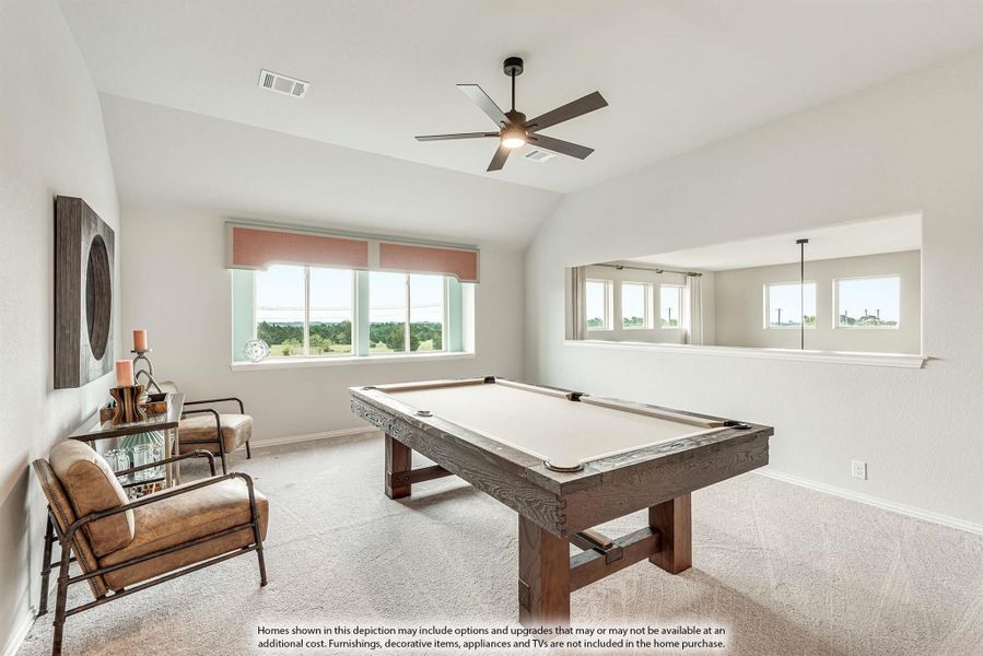 Game room with wood pool table, vaulted ceiling, ceiling fan, and carpet flooring