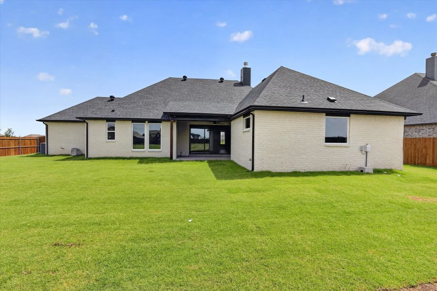 Front exterior of a new home in Coyote Crossing, Godley, TX, highlighting curb appeal (Image 24).