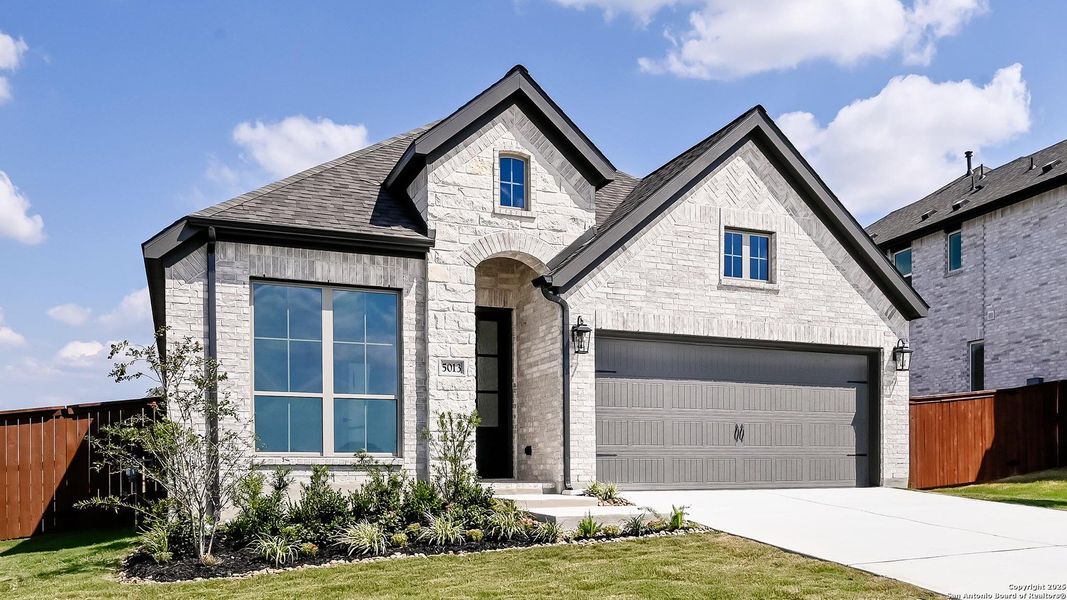 Front exterior of a new home in Homestead 55', Cibolo, TX, highlighting curb appeal (Image 25).