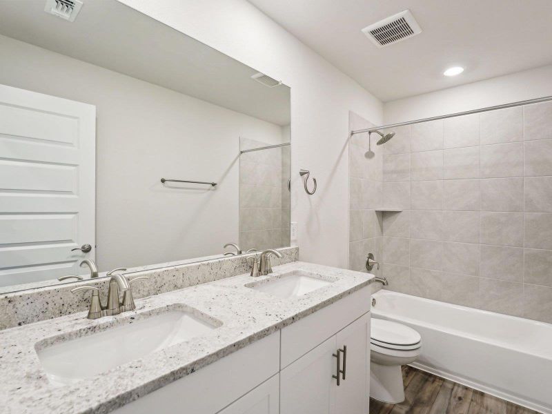 Furnished interior view inside a new home in Riverbend at Double Eagle - Boulevard Collection, Cedar Creek (Image 9). Furnished interior view inside a new home in Riverbend at Double Eagle - Boulevard Collection, Cedar Creek (Image 9).