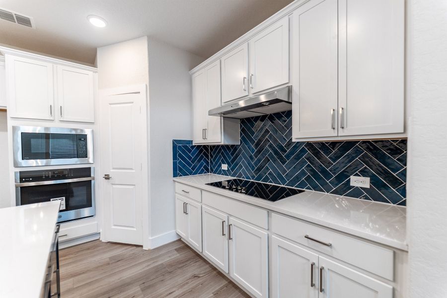 Furnished interior view inside a new home in The Woodlands at Medina Hills, Mico (Image 5).