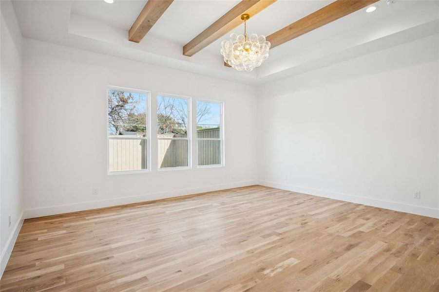 Designer light fixtures and master bedroom with pool view.