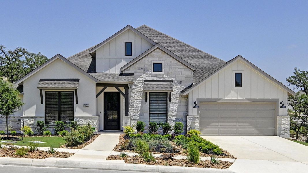 Front exterior of a new home in Esperanza 80', Boerne, TX, highlighting curb appeal (Image 1).