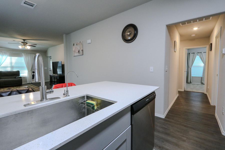 Kitchen to hallway to guest bedrooms. Kitchen to hallway to guest bedrooms.