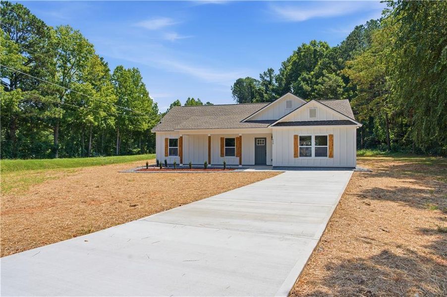 Front exterior of a new home in , Dallas, GA, highlighting curb appeal (Image 1). Front exterior of a new home in , Dallas, GA, highlighting curb appeal (Image 1).