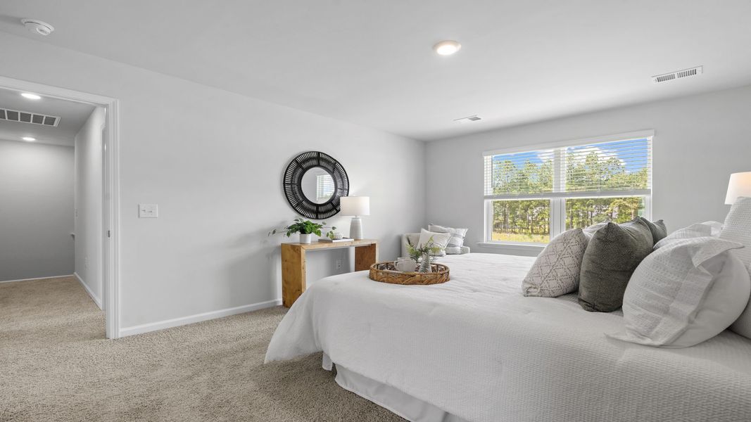 Furnished interior view inside a new home in The Groves at Bees Creek, Ridgeland (Image 27). Furnished interior view inside a new home in The Groves at Bees Creek, Ridgeland (Image 27).
