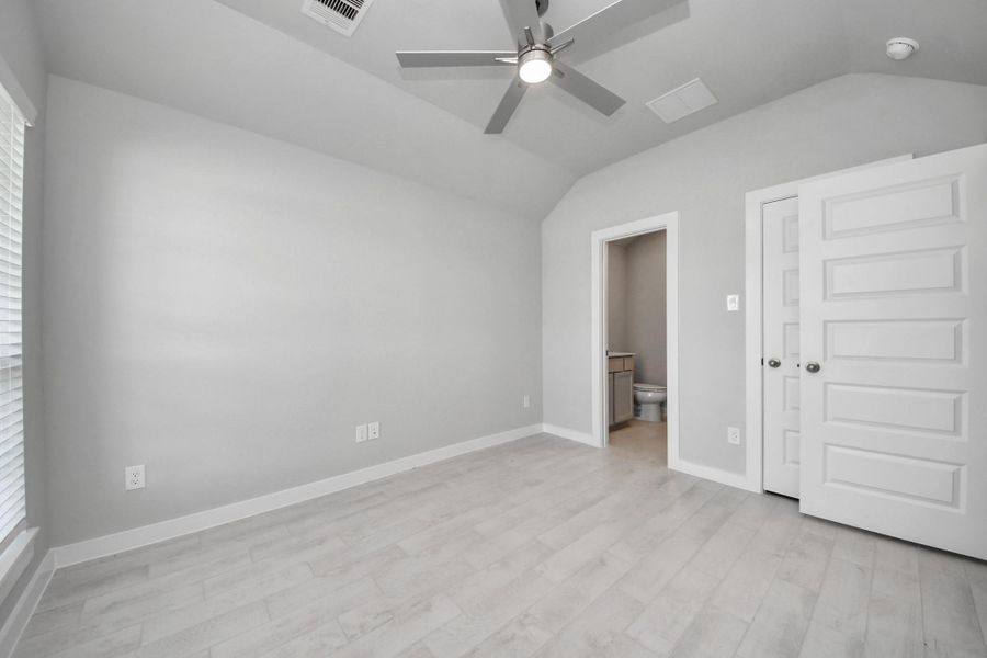 Generously sized secondary bedrooms featuring spacious closets, soft and inviting carpeting underfoot, large windows allowing plenty of natural light, and the added touch of privacy blinds for your personal retreat. Sample photo of completed home with similar floor plan. Actual colors and selections may vary.