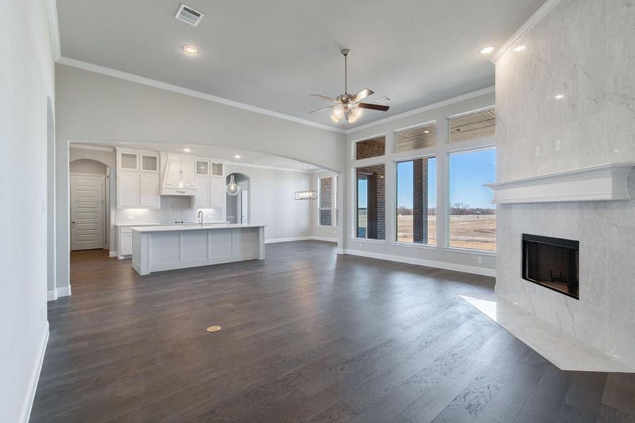 Family Room to Kitchen | Concept 2915 at The Meadows in Gunter, TX by Landsea Homes