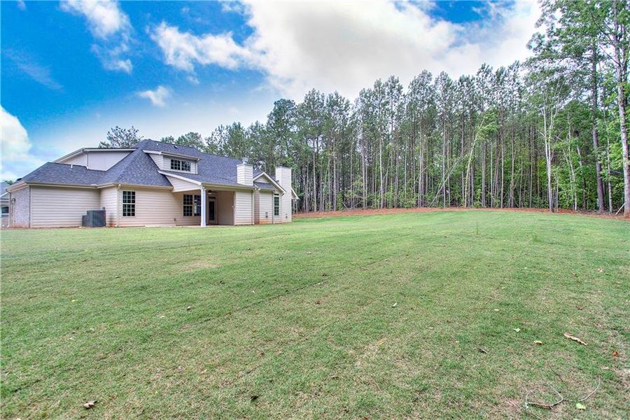 Front exterior of a new home in , Conyers, GA, highlighting curb appeal (Image 25). Front exterior of a new home in , Conyers, GA, highlighting curb appeal (Image 25).