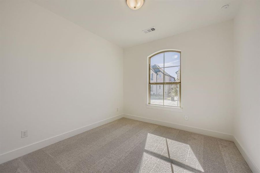 Empty room with light colored carpet Empty room with light colored carpet