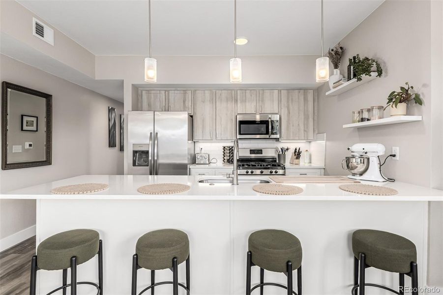 Large kitchen island with bar seating.