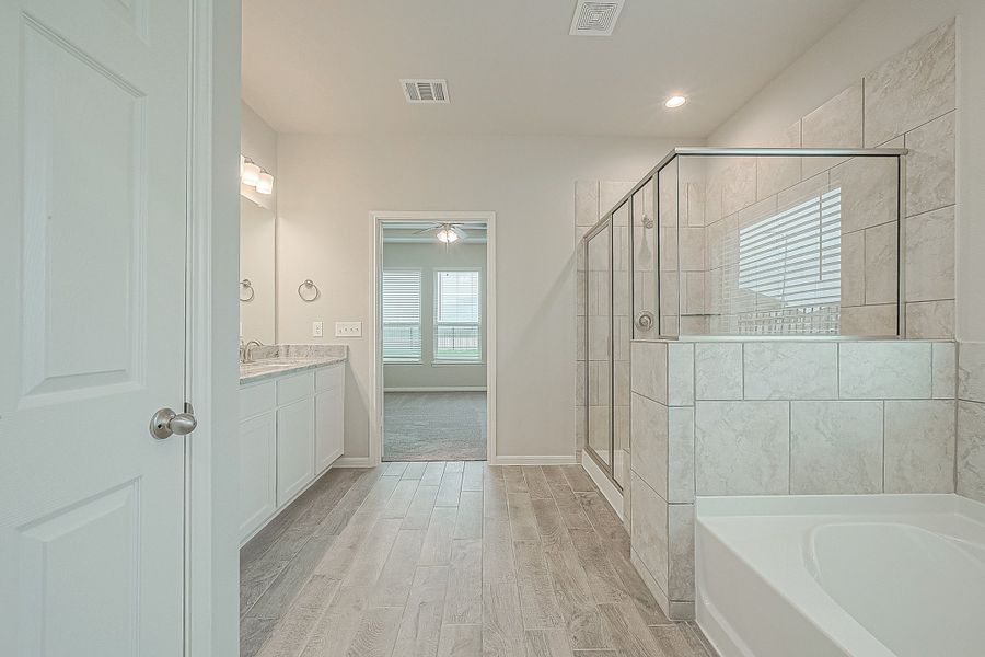 Representative furnished interior of a home built from the Floor Plan 2050 by Colina Homes in Grand Magnolia, Magnolia (Image 11).