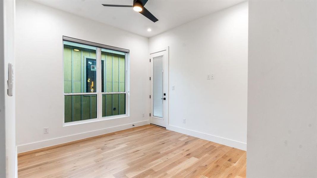 Empty room featuring light hardwood / wood-style floors and ceiling fan