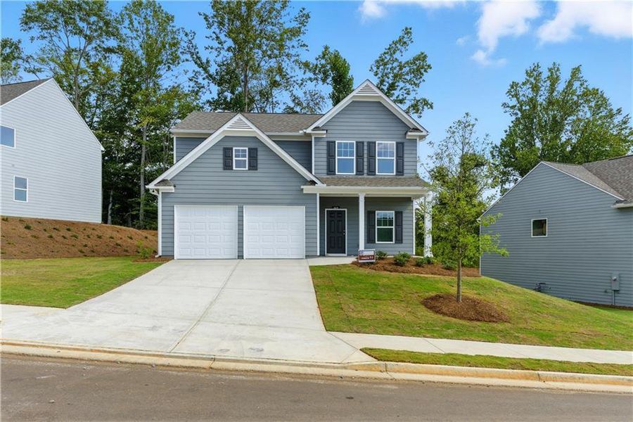 Front exterior of a new home in The Reserve at Willow Oaks, Canton, GA, highlighting curb appeal (Image 1). Front exterior of a new home in The Reserve at Willow Oaks, Canton, GA, highlighting curb appeal (Image 1).