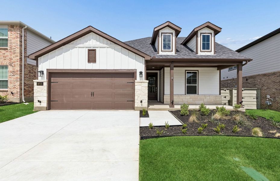 Front exterior of a new home in Treeline, Justin, TX, highlighting curb appeal (Image 1). Front exterior of a new home in Treeline, Justin, TX, highlighting curb appeal (Image 1).
