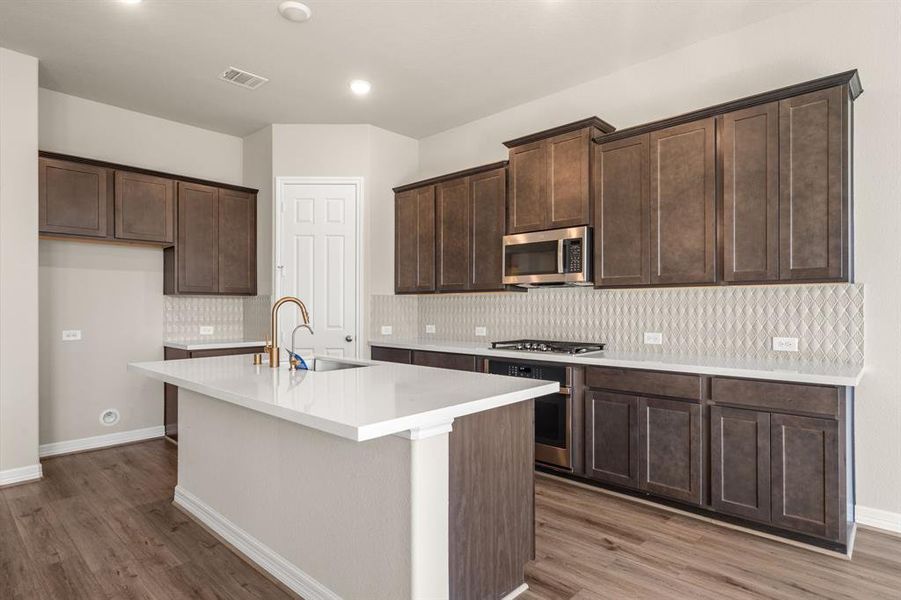 This kitchen is not only a functional space but also has ample storage. Whether you're a seasoned chef or just love to gather and enjoy good food, this kitchen is a dream come true.