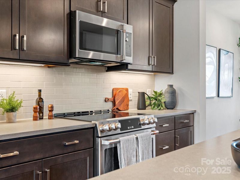 GE Stainless Appliances with Electric Range.