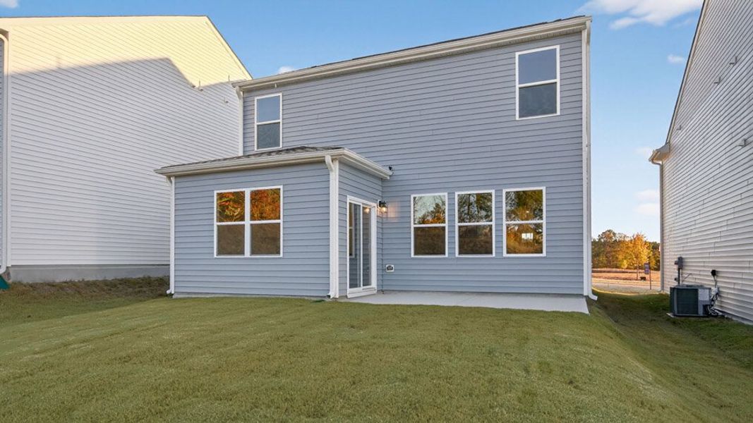 Exterior details and patio area of a home in The Grove at Matthews Landing, Fuquay Varina (Image 4).