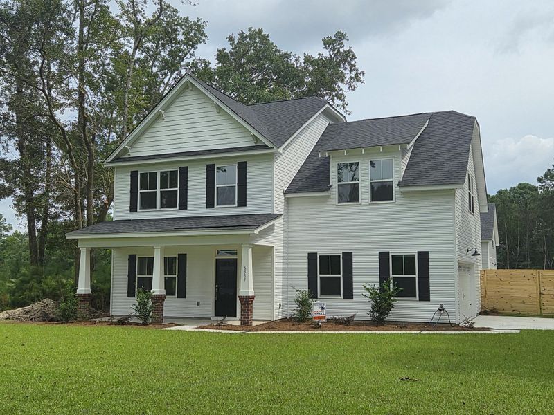 Front exterior of a new home in , Awendaw, SC, highlighting curb appeal (Image 2).
