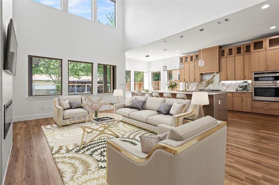 Living room with sink, hardwood / wood-style flooring, and a wealth of natural light