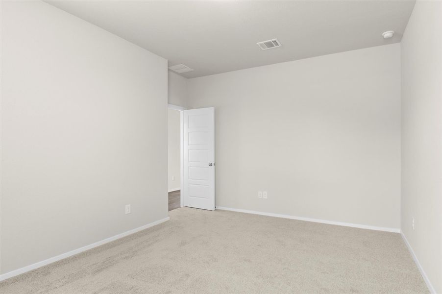 Empty room with carpet floors