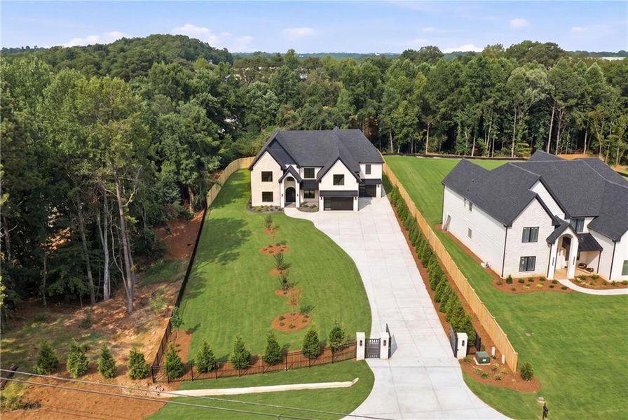 Front exterior of a new home in , Suwanee, GA, highlighting curb appeal (Image 27).