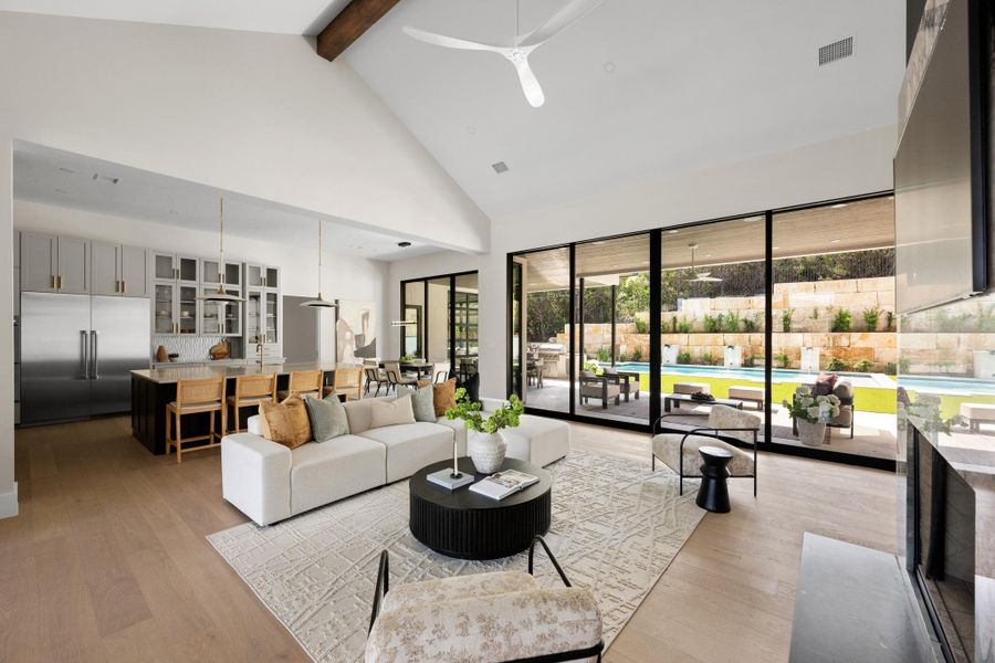 Serene yet striking, the main living centers around a breathtaking fireplace with a custom quartzite surround that draws the eye upward