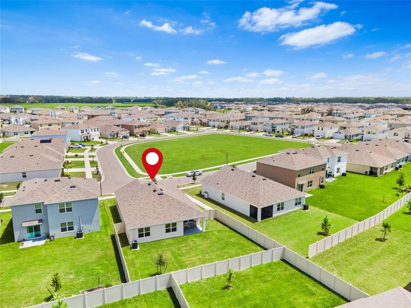 Front of Home Faces a Large Green Space.