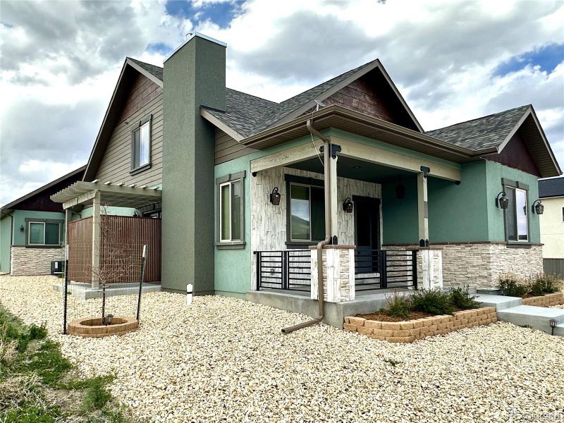 Front exterior of a new home in , Poncha Springs, CO, highlighting curb appeal (Image 22).
