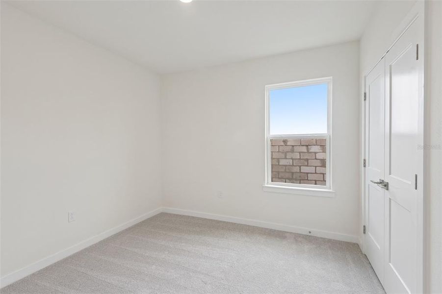 Spacious, unfurnished interior of a new home in Grasslands West, Lakeland (Image 28).